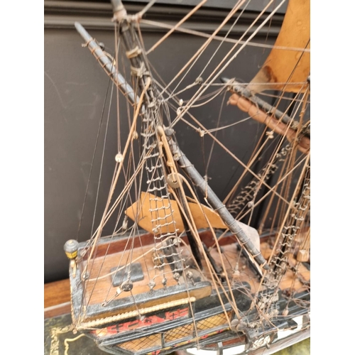 1178 - A painted wood model galleon, 70cm long, on wood stand. 