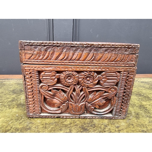 1190 - An Eastern carved wood casket, 28.5cm wide. 