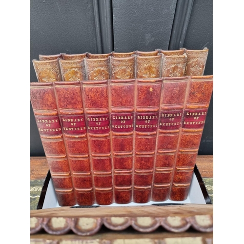 1193 - Nine simulated leather book spines, largest 31.5 x 29cm. 