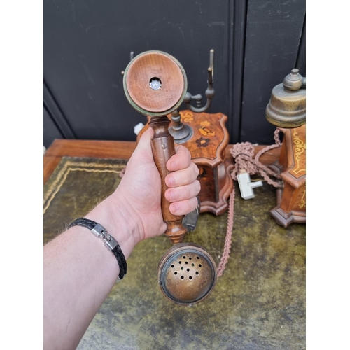 1203 - Two antique style marquetry telephones. 