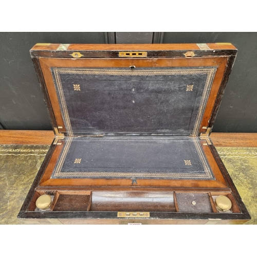 1205 - A large walnut and brass bound writing slope, 50cm wide; together with another rosewood example... 