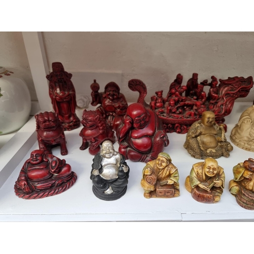 1225 - A collection of resin and other Buddhas and similar, largest 34.5cm high. (24) ... 