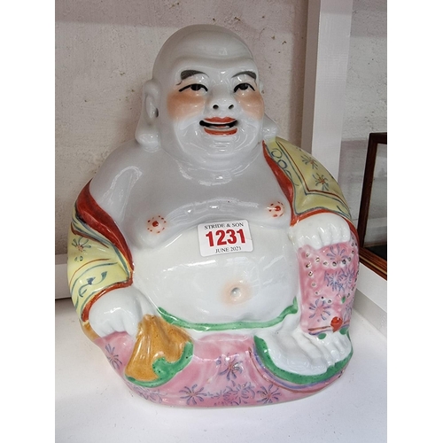 1231 - A graduated set of six Chinese famille rose Buddhas, largest 21cm high. 