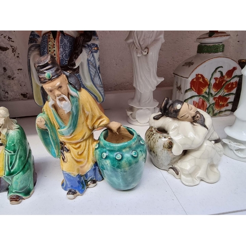 1233 - A collection of Chinese ceramics, to include figures, largest 24cm high; and a Yixing teapot and cov... 