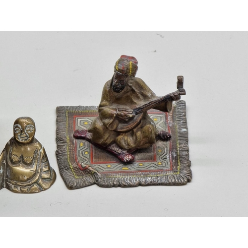 1258 - A cold painted bronze figure of an Arab on carpet, in the manner of Franz Bergman, 7cm wide; and two... 