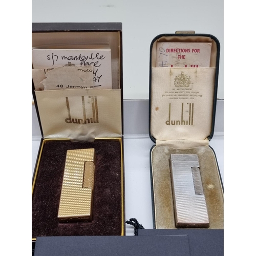 1263 - Two Dunhill engine turned lighters, each boxed, with instructions and repair guarantee cards.... 