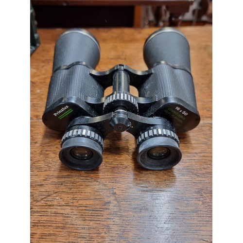 1319 - A pair of Ross 9x35 binoculars, cased; together with two other pairs of binoculars; and two pairs of... 