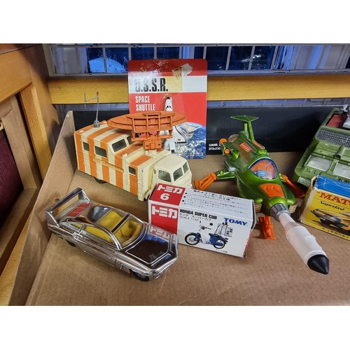 15 - Diecast: a collection of vintage diecast vehicles, to include an Ertl Soviet Space Shuttle, in origi... 