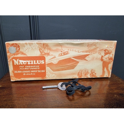 18 - Nautilus: a vintage clockwork submarine, by Sutcliffe, with winding key, rubber stopper and periscop... 