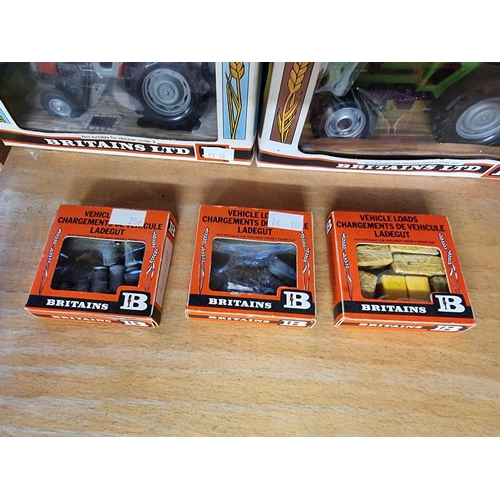 34 - Britains: a group of vintage farm vehicles and accessories, comprising Nos: 9526, 9520, 9522, and 95... 