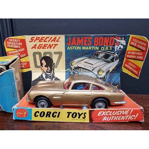 35 - Corgi: a vintage James Bond 'Goldfinger' Aston Martin DB5 in original box, (heavily taped with some ... 