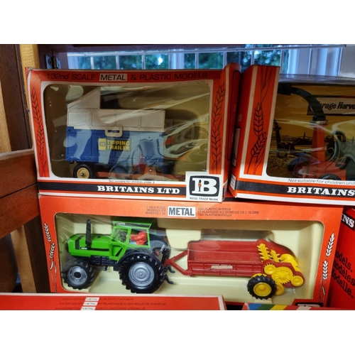 38 - Britains: eleven vintage boxed farm vehicles and machinery, to include No.9578 Loader Wagon. (11)... 