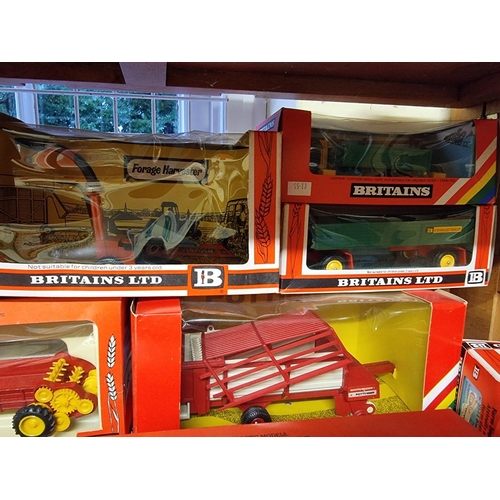 38 - Britains: eleven vintage boxed farm vehicles and machinery, to include No.9578 Loader Wagon. (11)... 