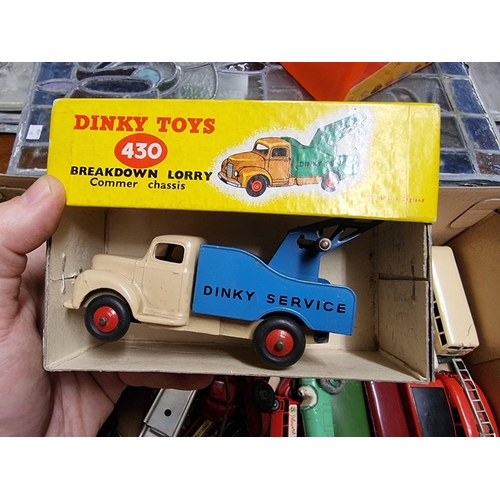 43 - Diecast: a group of vintage diecast vehicles, mainly Dinky, to include a boxed No.430 lorry; two rac... 