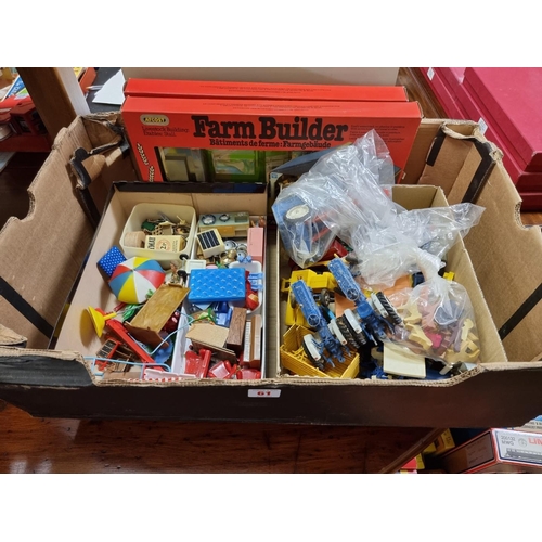 61 - Britains: two vintage Farm Builder kits; together with a similar Britains model farmyard play base, ... 