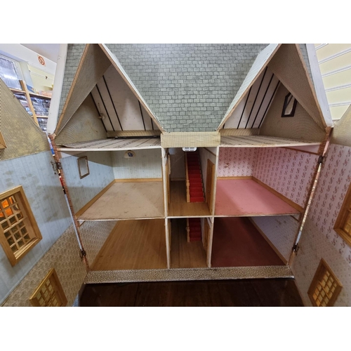 68 - Dolls House: a large three storey wooden dolls house, 87cm high x 78.5cm wide x 35.5cm deep.... 