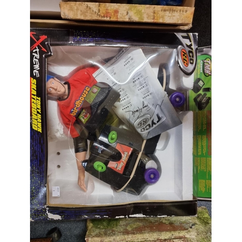 70 - Toys and Pastimes: a Tyco R/C Tony Hawk, boxed; together with a group of board games and similar; to... 