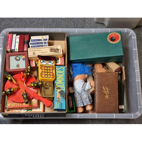 71 - Toys and Pastimes: a group of vintage games, to include Winkles Wedding, a boxed set of carpet bowls... 