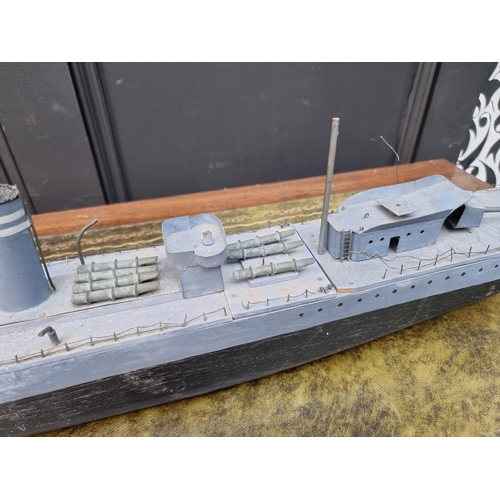 77 - A painted wood model of HMS Fury, 91cm long.