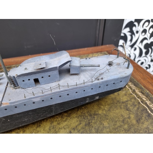 77 - A painted wood model of HMS Fury, 91cm long.