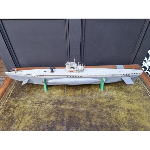 78 - A painted wood model German U-boat, 96.5cm long, on wood stand. 