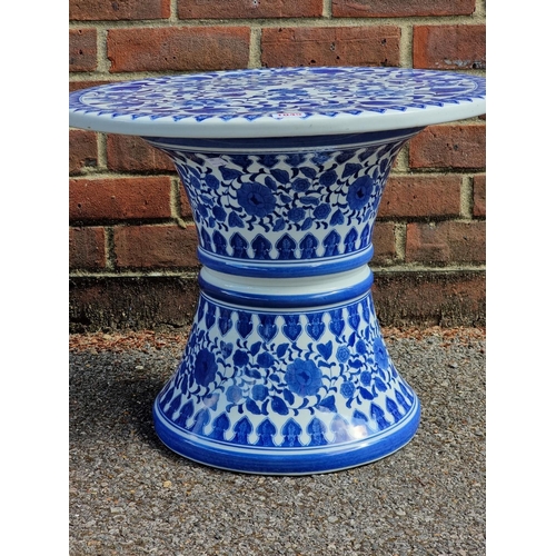 1045 - A blue and white porcelain circular conservatory table, 42cm high x 52.5cm wide. ... 