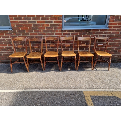 1100 - A matched set of six Victorian beech and elm bar back kitchen chairs. 