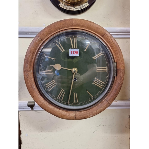 1126 - An antique oak fusee wall clock, with 9 1/2in green painted dial, with pendulum. ... 