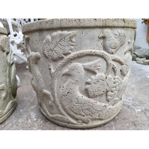 1149 - A pair of composition stone garden planters, with relief decoration, 31.5cm high x 39cm diameter.... 