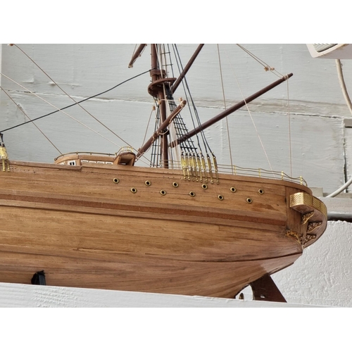 1177 - A model galleon, total length 98.5cm, on ebonized stand. 