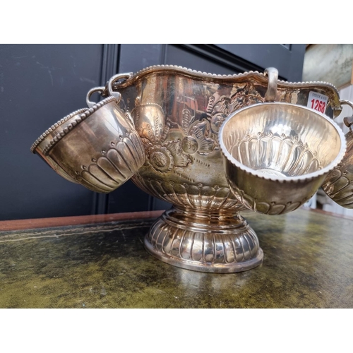 1268 - A large electroplated punch bowl and eight cups, 32cm diameter; together with associated ladle.... 