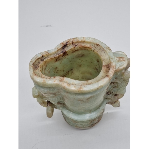 1492 - A Chinese Archaistic style carved green and russet jade ewer and cover, 22cm high, (chips to cover).... 