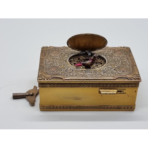 1500 - A Karl Greisbaum model 18 singing bird box automaton, circa 1930, 10.5cm wide, with original key.... 