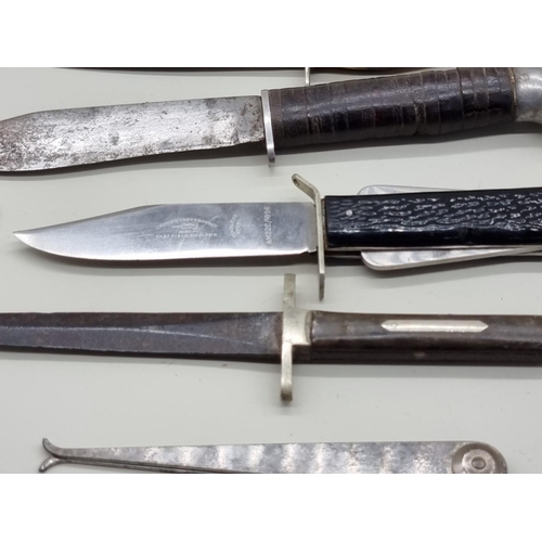 1506 - A small collection of vintage knives, gauges and similar, to include an RAF Air Crew survival knife.... 