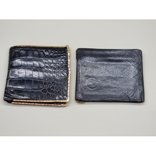 1511 - A 9ct gold mounted snakeskin wallet, by Asprey; together with another Harrods black leather exa... 