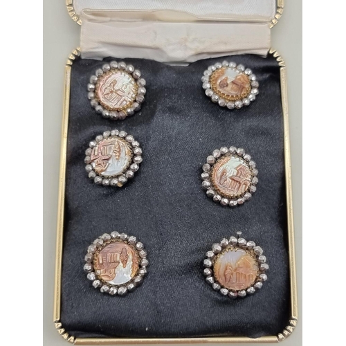 1515 - A set of six 19th century carved mother of pearl and marcasite buttons, each 17mm diameter.... 