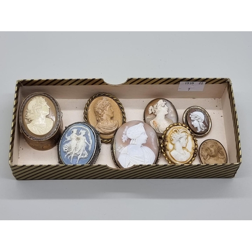 1527 - A small collection of cameo brooches and similar. (8)