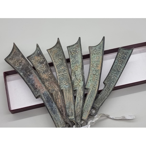 1529 - A small group of Chinese bronze knife money, longest 16.5cm.