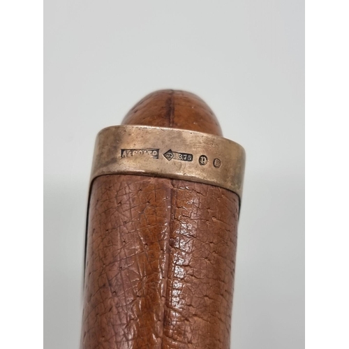 1530 - A vintage 9ct gold mounted tan leather cigar sleeve, 16cm long. 