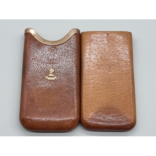 1530 - A vintage 9ct gold mounted tan leather cigar sleeve, 16cm long. 