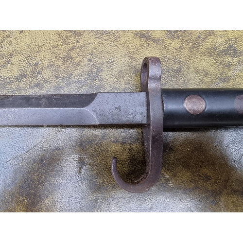 1590 - An Austrian World War I Mannlicher bayonet, the 35cm blade inscribed 'CE WG'.