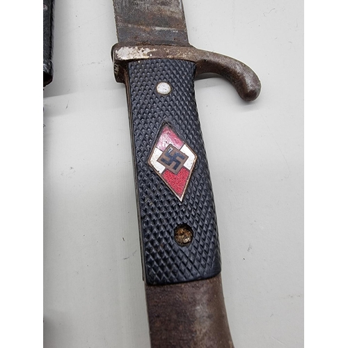 1595 - A Third Reich Hitler Youth knife and sheath, the 13.5cm blade inscribed 'RZM M7/62, 1938'.... 