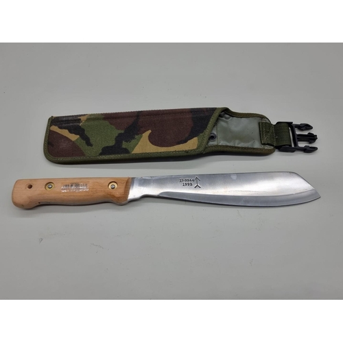 1601 - A military machete and scabbard, the 25.5cm blade inscribed '179944, 1993' together with another mac... 