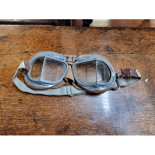 1603 - A World War II RAF pilot's leather C Type flying helmet, with earphones and wiring loom; together wi... 