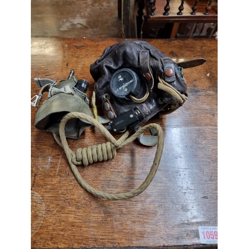 1603 - A World War II RAF pilot's leather C Type flying helmet, with earphones and wiring loom; together wi... 