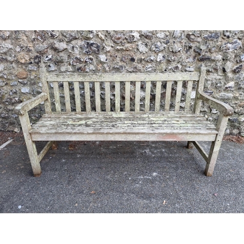 1632 - A teak garden bench, 152cm wide.