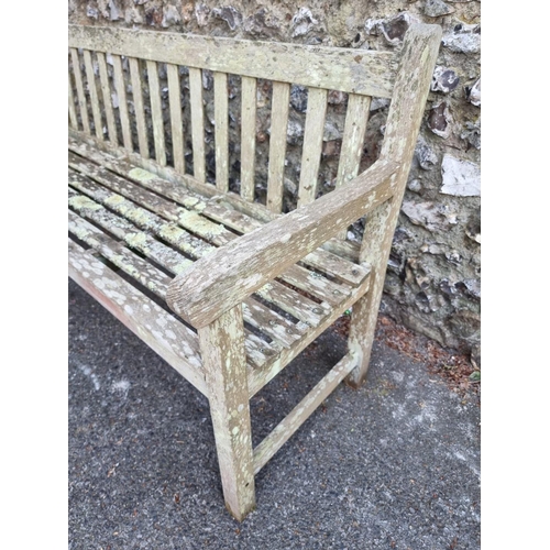 1632 - A teak garden bench, 152cm wide.