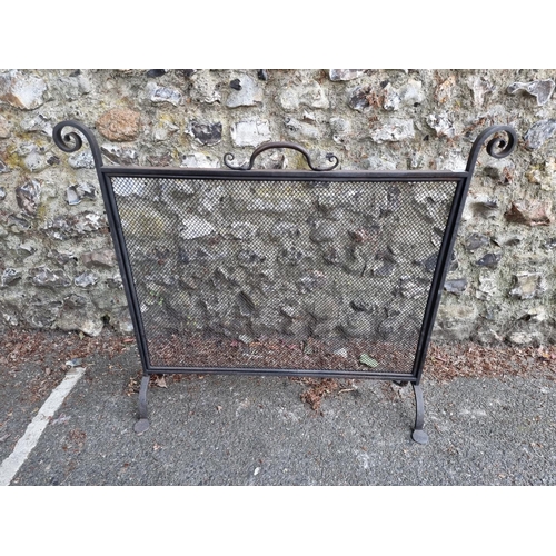 1634 - A black painted steel fire guard, 91.5cm.