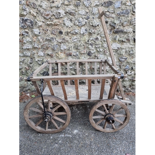 1637 - A small old wooden cart, 68cm wide; together with an old ox yoke.