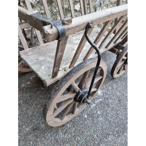 1637 - A small old wooden cart, 68cm wide; together with an old ox yoke.